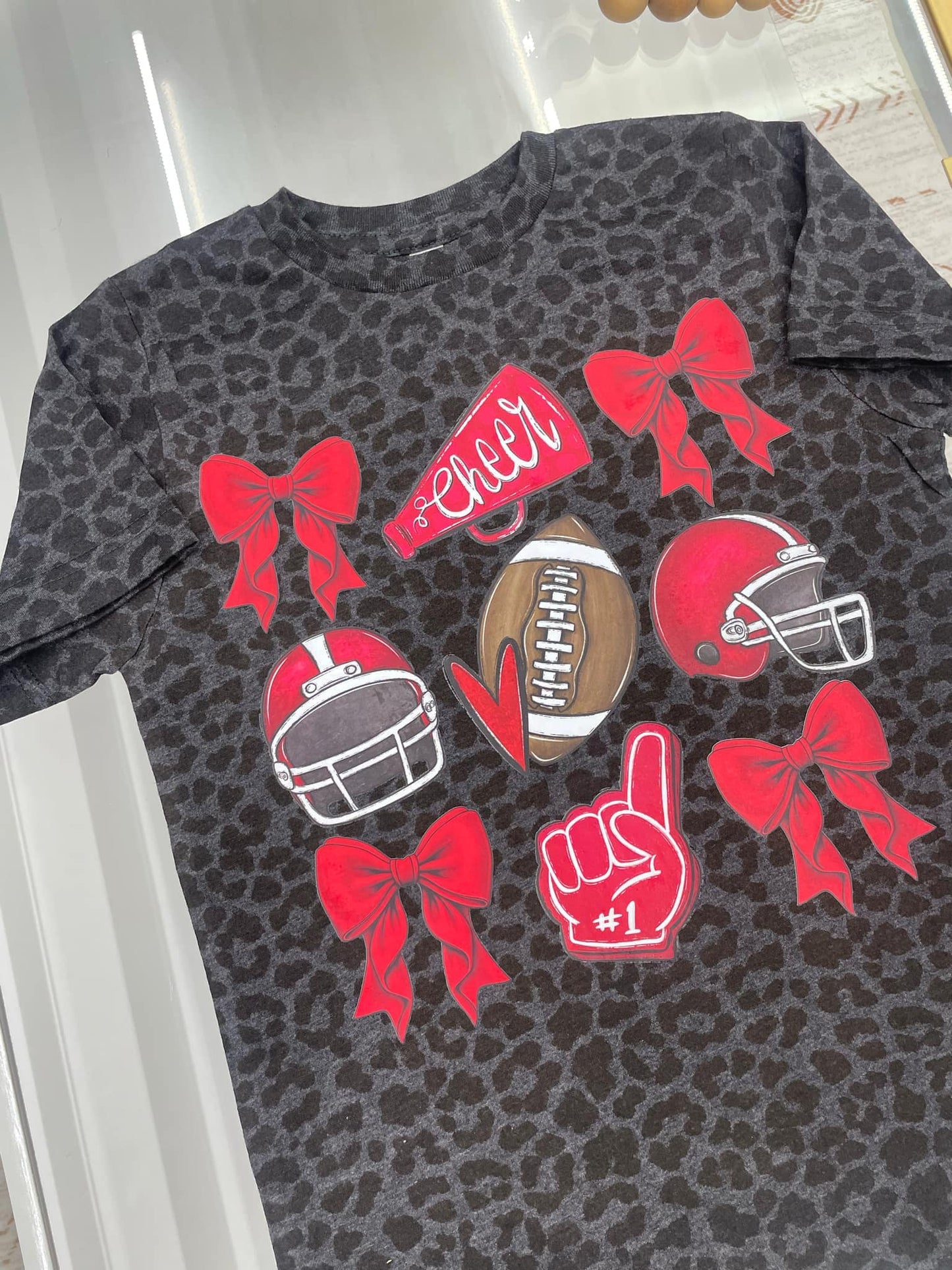 Red Bow, cheer megaphone, red helmet, foam finger t-shirt