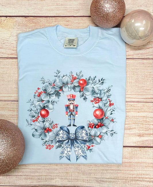 Nutcracker and wreath (blue wreath red ornaments, blue and white bow) T SHIRT (CC & BELLA)