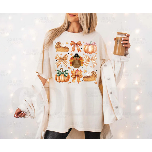 Pumpkin pie, orange bow, pumpkin turkey in the center T-shirt (BELLA AND COLOR COMFORT